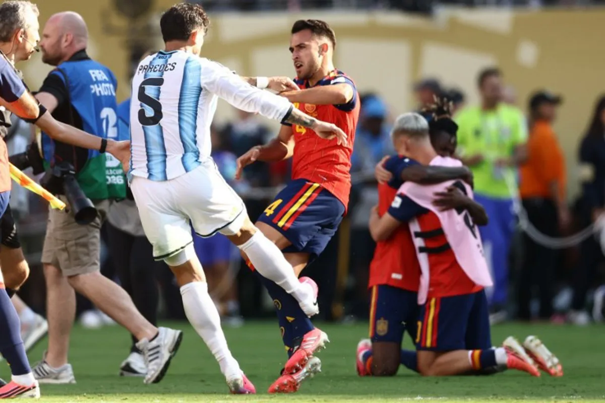 (FILES) Argentina's midfielder #05 Leandro Paredes (L) clashes with Spain's defender #04 Eric Garcia at the end of the 2026 World Cup football tournament final match between Spain and Argentina at the New York/New Jersey Stadium in East Rutherford on July 19, 2026. FIFA announced on July 29, 2026 that it had opened proceedings into some Argentina players for their behaviour after losing the World Cup to Spain. A handful of Argentina players and staff confronted their Spanish rivals after the final whistle of the final in New York which Spain won 1-0 after extra time. Argentina players including Nahuel Molina, Thiago Almada and Leandro Paredes, as well as Argentinian official Roberto Ayala, were involved in the incidents, as was Spain's Pablo Martin Paez Gavira. CHARLY TRIBALLEAU / AFP