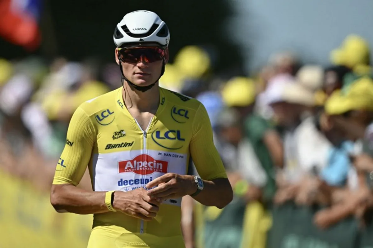Alpecin - Deceuninck team's Dutch rider Mathieu van der Poel wearing the overall leader's yellow jersey looks on after passing the finish line during the 7th stage of the 112th edition of the Tour de France cycling race, 197 km between Saint-Malo and Mur-de-Bretagne Guerledan, in Brittany, western France, on July 11, 2025. Loic VENANCE / AFP