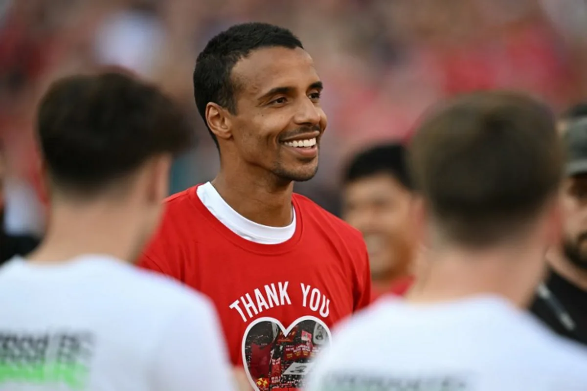 Liverpool's German-born Cameroonian defender #32 Joel Matip says goodbye to the fans after the English Premier League football match between Liverpool and Wolverhampton Wanderers at Anfield in Liverpool, north west England on May 19, 2024.  Paul ELLIS / AFP