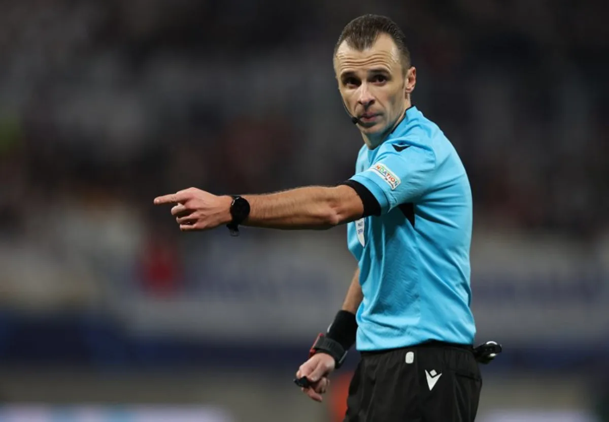 Bosnian Herzegovian referee Irfan Peljto gestures during the UEFA Champions League Round of 16, first-leg football match between RB Leipzig and Real Madrid CF in Leipzig, eastern Germany, on February 13, 2024.  Ronny HARTMANN / AFP