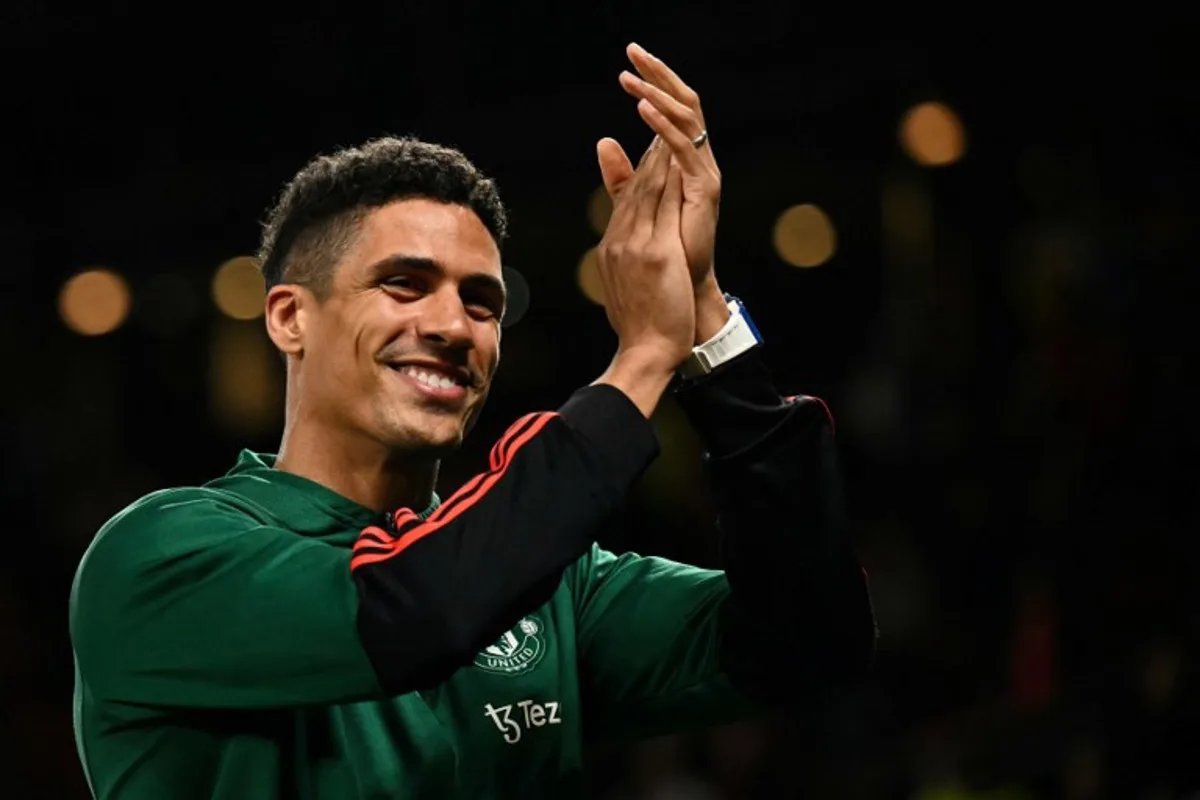 Manchester United's French defender #19 Raphael Varane applauds the supporters at the end of the English Premier League football match between Manchester United and Newcastle United at Old Trafford in Manchester, north west England, on May 15, 2024. Manchester United wins 3 - 2 against Newcastle United.  Oli SCARFF / AFP