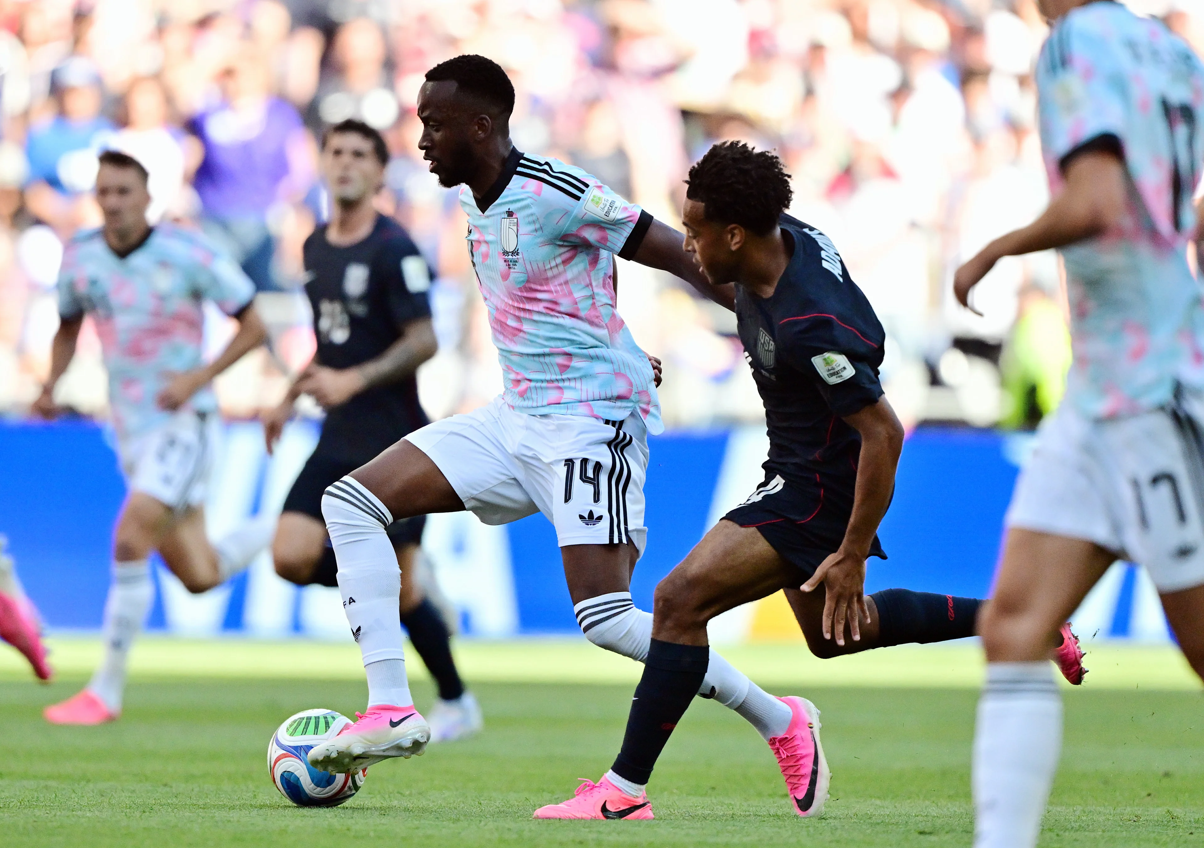 Belgium's Dodi Lukebakio and US' Tyler Adams fight for the ball during a soccer game between the USA and Belgian national team Red Devils, on Monday 06 July 2026, at the Seattle Field, in Seattle, a 1/8 finals game in the FIFA World Cup 2026. BELGA PHOTO DIRK WAEM