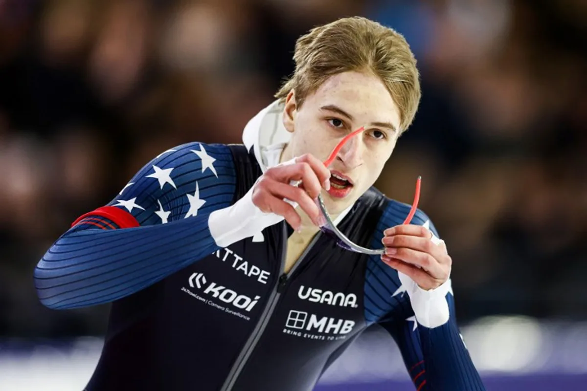 US Jordan Stolz celebrates winning the 1000 meters men's race at the ISU World Speed Skating Championships in Thialf arena in Heerenveen on March 4, 2023.  Vincent Jannink / ANP / AFP