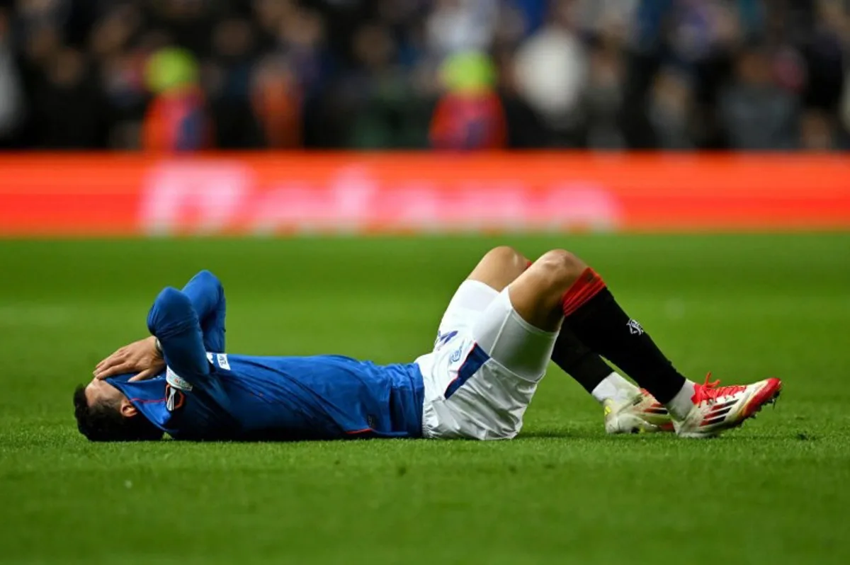 Rangers' Brazilian defender #22 Jefte reacts during the UEFA Europa League second-leg round of 16 football match between Rangers and Fenerbahce SK at the Ibrox Stadium in Glasgow on March 13, 2025. ANDY BUCHANAN / AFP