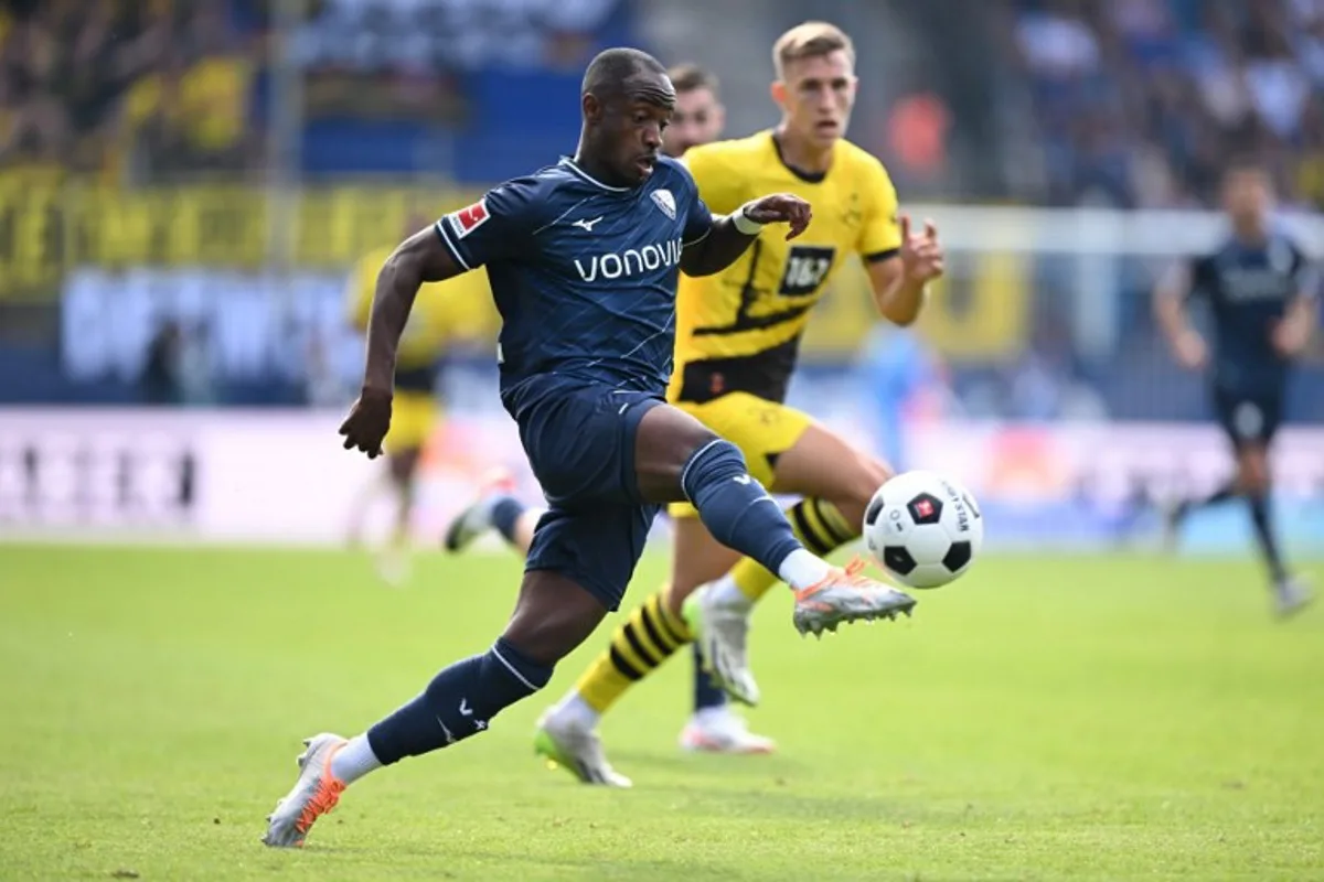 Bochum's Ghanaian forward #22 Christopher Antwi-Adjei (L) and Dortmund's German defender #04 Nico Schlotterbeck vie for the ball during the German first division Bundesliga football match between VfL Bochum and BVB Borussia Dortmund in Bochum, western Germany on August 26, 2023. INA FASSBENDER / AFP
