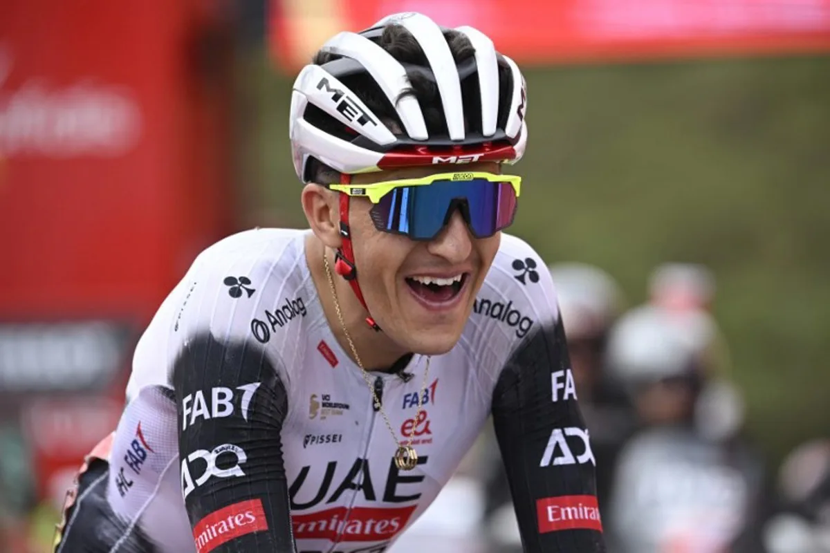Team UAE's Spanish rider Marc Soler reacts to winning the 14th stage of the Vuelta a Espana cycling tour, a 135 km race between Aviles and La Farrapona in Somiedo, on September 6, 2025. Miguel RIOPA / AFP