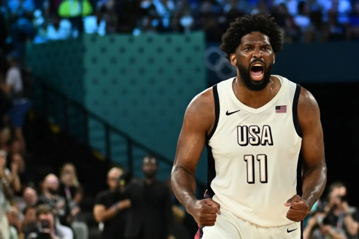 USA's #11 Joel Embiid celebrates after scoring in the men's semifinal basketball match between USA and Serbia during the Paris 2024 Olympic Games at the Bercy  Arena in Paris on August 8, 2024.  Aris MESSINIS / AFP