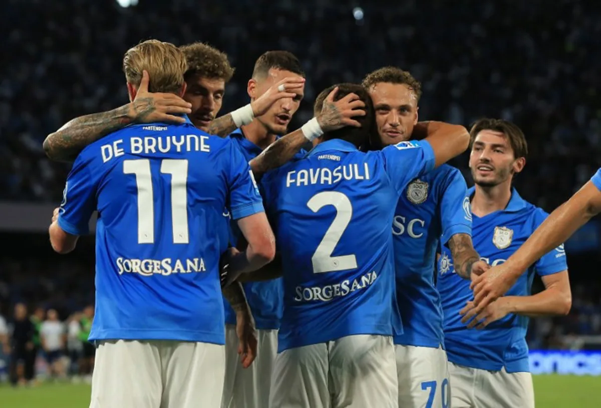 Napoli's players celebrate their team's first goal during the  Italian Serie A football match SSC Napoli vs Bologna FC 1909 at the Diego Armando Maradona Stadium in Naples on September 13, 2026.  CARLO HERMANN / AFP