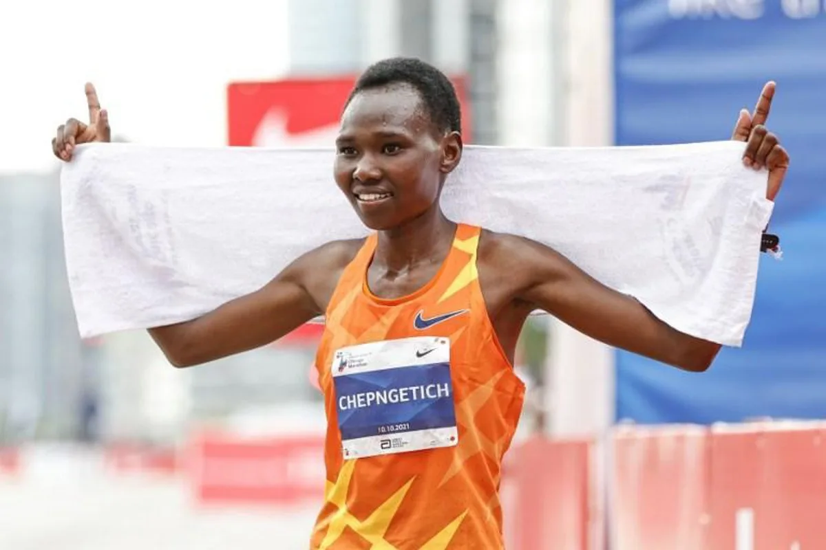 Kenya's Ruth Chepngetich reacts after winning the Elite Women's 2021 Bank of America Chicago Marathon on October 10, 2021 in Chicago, Illinois.   Reigning world champion Ruth Chepngetich of Kenya made a triumphant US debut on by winning the women's title at the 43rd Chicago Marathon. Chepngetich won in an unofficial time of 2hrs 22mins 31secs to defeat American runner-up Emma Bates by 1:49 with another Sara Hall, also of the United States, third in 2:27:19. KAMIL KRZACZYNSKI / AFP