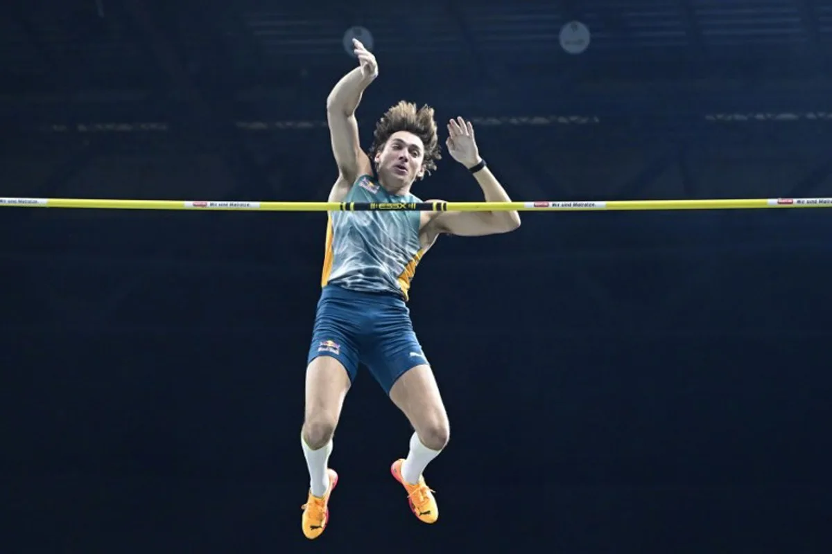 Sweden's Armand Duplantis clears the 6,10 metres bar during the men's pole vault event of the ISTAF Athletics Indoor Meeting 2025 in Berlin on February 14, 2025.  John MACDOUGALL / AFP