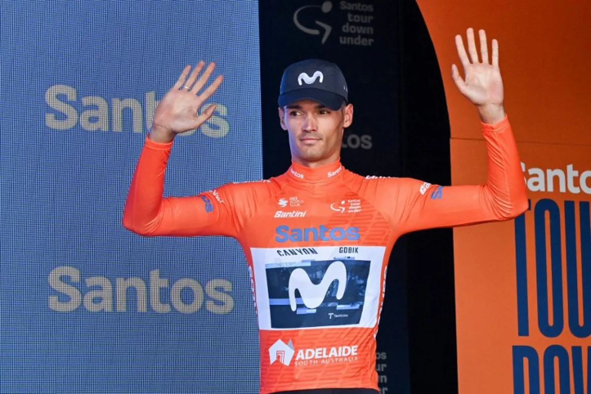 Movistar Team rider Javier Romo Oliver from Spain who holds the leaders ochre jersey reacts on the podium after stage 4 of the Tour Down Under cycling race in Adelaide on January 24, 2025. Brenton Edwards / AFP