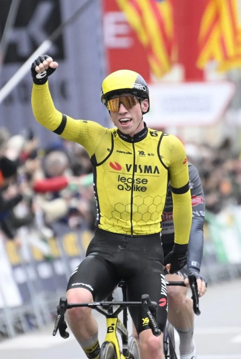 Team Visma's British rider James Matthew Brennan (L) celebrates crossing first the finish line ahead of Team Alpecin's Kaden Groves at the end of the first stage of the 2025 Volta a Catalonya cycling tour of Catalonya, a 178,3 km loop starting and finishing in Sant Feliu de Guixols, on March 24, 2025. Josep LAGO / AFP