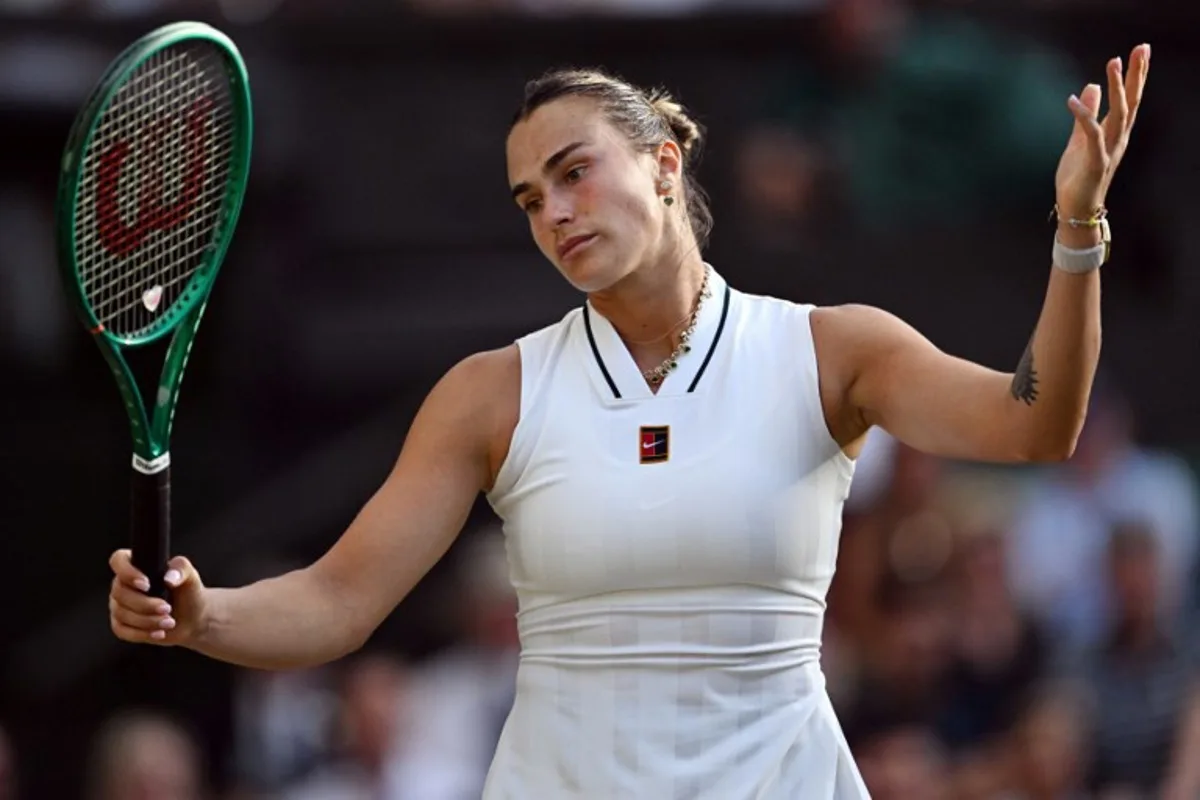 Belarus's Aryna Sabalenka reacts as she plays against Japan's Naomi Osaka during their women's singles round of 16 tennis match on the seventh day of the 2026 Wimbledon Championships at The All England Lawn Tennis and Croquet Club in Wimbledon, southwest London, on July 5, 2026.  Kirill KUDRYAVTSEV / AFP
