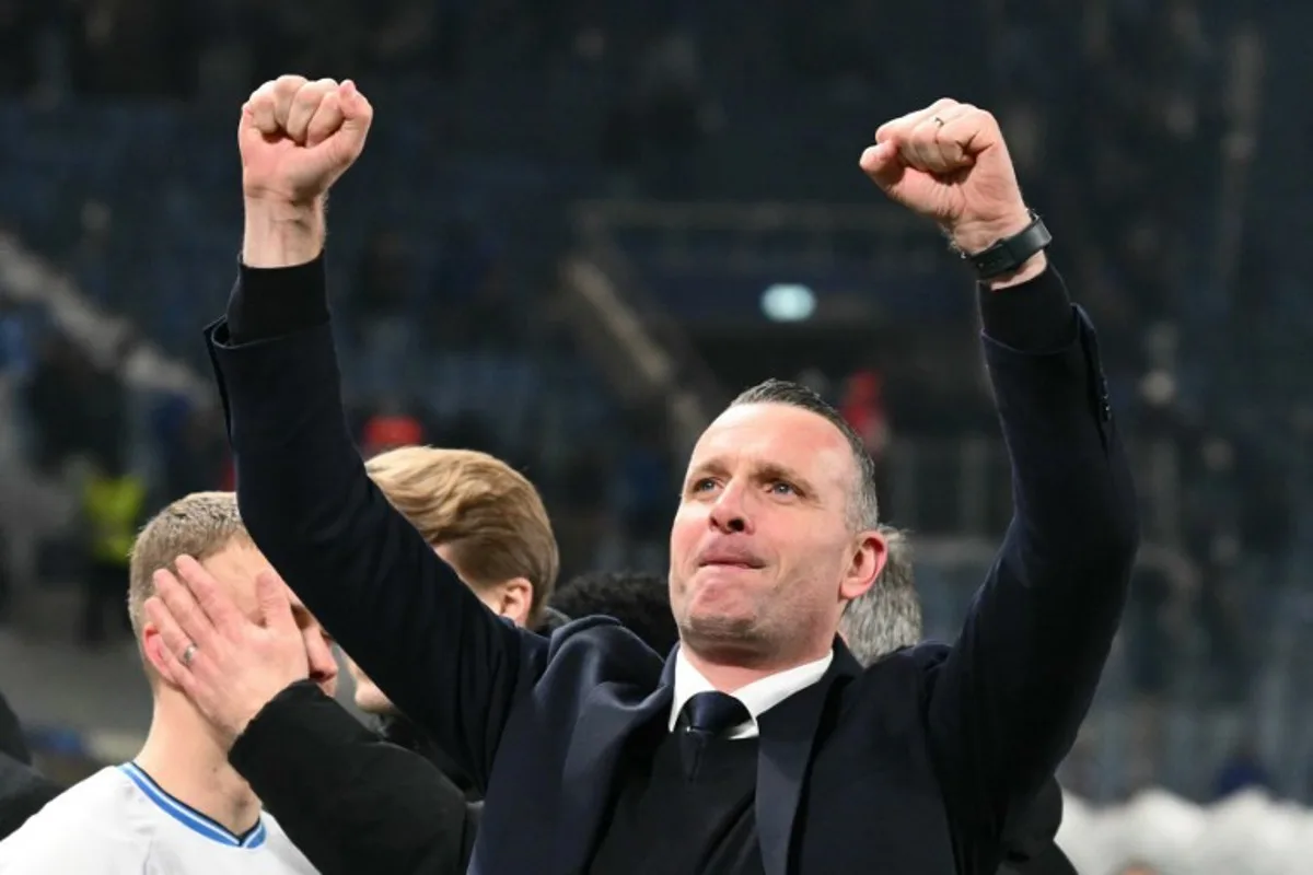 Club Brugge's Belgian coach Nicky Hayen celebrates after winning the UEFA Champions League knockout phase play-off 2nd leg football match between Club Brugge KV and Atalanta at the Stadio di Bergamo in Bergamo on February 18, 2025.  Alberto PIZZOLI / AFP