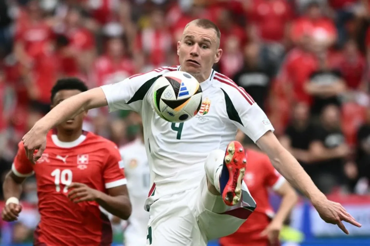 Hungary's defender #04 Attila Szalai controls the ball during the UEFA Euro 2024 Group A football match between Hungary and Switzerland at the Cologne Stadium in Cologne on June 15, 2024.  Angelos Tzortzinis / AFP