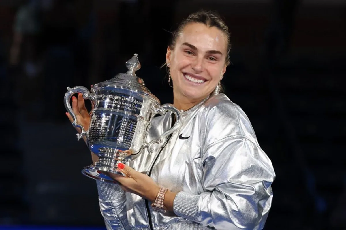 Belarus's Aryna Sabalenka poses with the trophy after defeating USA's Amanda Anisimova during their women's singles final tennis match on day fourteen of the US Open tennis tournament at the USTA Billie Jean King National Tennis Center in New York City, on September 6, 2025. TIMOTHY A.CLARY / AFP