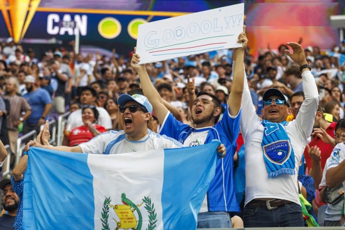 Guatemala fans celebrate after their team won the CONCACAF Gold Cup quarterfinal match against Canada in a penalty shootout at US Bank Stadium in Minneapolis, Minnesota on June 29, 2025. Kerem YUCEL / AFP