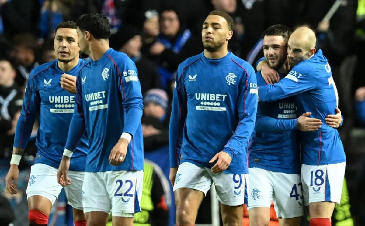 Rangers' Belgian midfielder #43 Nicolas Raskin (2R) celebrates scoring the opening goal during the UEFA Europa League football match between Rangers and Royale Union Saint-Gilloise at the Ibrox Stadium in Glasgow on January 30, 2025. ANDY BUCHANAN / AFP