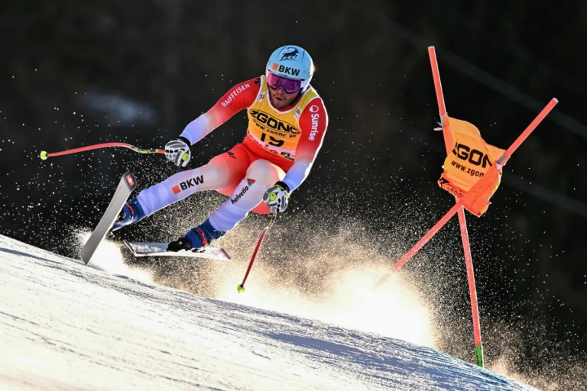 Switzerland's Alexis Monney competes in the Men's Downhill race as part of the FIS Alpine Ski World Cup 2024-2025, in Bormio, Italy, on December 28, 2024.  FABRICE COFFRINI / AFP