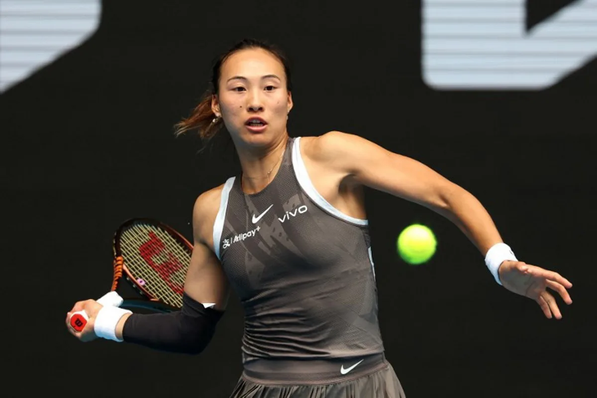 China's Zheng Qinwen hits a return against Germany's Laura Siegemund during their women's singles match on day four of the Australian Open tennis tournament in Melbourne on January 15, 2025.  DAVID GRAY / AFP