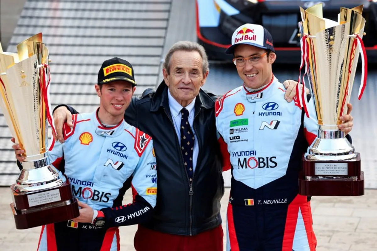 Belgian driver Thierry Neuville (R) and Belgian co-driver Martijn Wydaeghe celebrate on the podium after winning with their Hyundai I20 N Rally1 Hybrid for Hyundai Shell Mobis World Rally Team with Belgian former racing driver Jacky Ickx (C) after the 92nd WRC Monte-Carlo Rally, at Place du Casino in Monaco, southern France, on January 28, 2024.  Valery HACHE / AFP