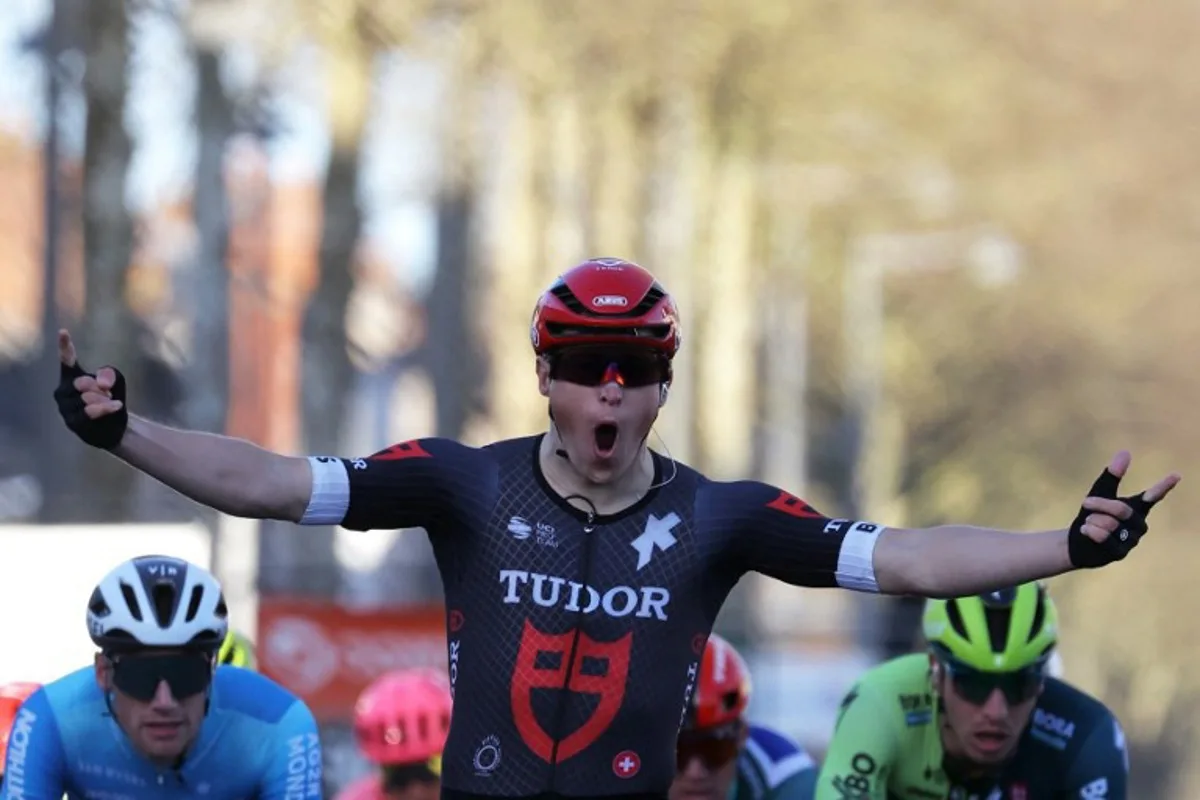 Tudor Pro Cycling Team's Dutch cyclist Arvid De Kleijn celebrates as he crosses the finish line during the 2nd stage of the Paris-Nice cycling race, 179 km between Thoiry and Montargis, on March 4, 2024. Thomas SAMSON / AFP