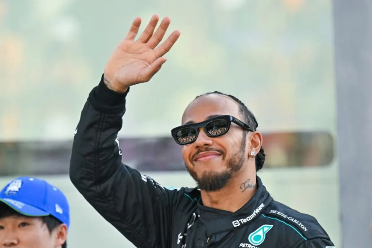 Mercedes' British driver Lewis Hamilton arrives for a group photo ahead of the Abu Dhabi Formula One Grand Prix at the Yas Marina Circuit in Abu Dhabi on December 8, 2024.  Andrej ISAKOVIC / AFP