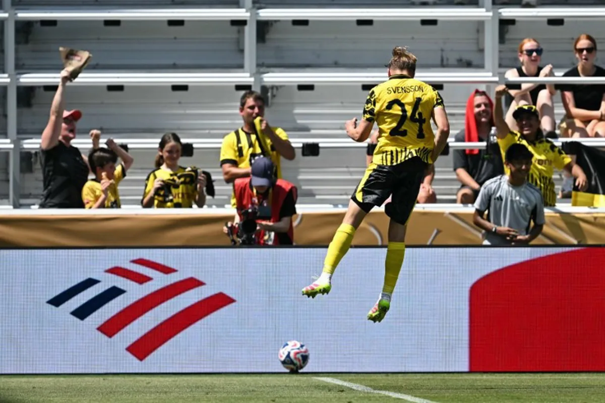 Borussia Dortmund's Swedish defender #24 Daniel Svensson celebrates scoring his team's first goal during the FIFA Club World Cup 2025 Group F football match between Germany's Borussia Dortmund and South Korea's Ulsan HD at the TQL stadium in Cincinnati on June 25, 2025. Paul ELLIS / AFP