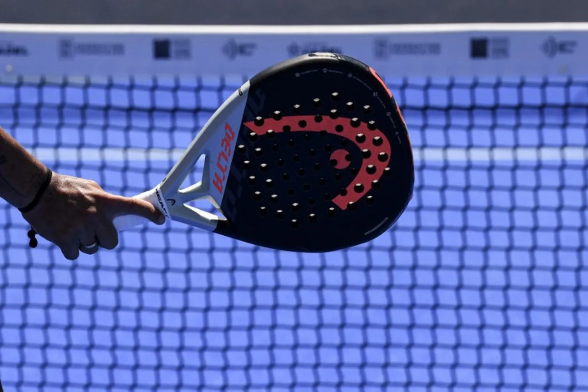 The racket used to play padel tennis is pictured at the Roland-Garros stadium in Paris on July 12, 2022. A few weeks after its main famous tournament, Roland-Garros changed scenery and rackets until July 17, 2022, to host a padel competition, a trendy derivative of tennis booming in France and elsewhere. ALAIN JOCARD / AFP