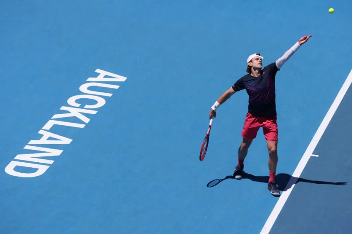 Belgium's Zizou Bergs serves against France's Gael Monfils during their men's singles final match at the ATP Auckland Classic tennis tournament in Auckland on January 11, 2025.  Michael Bradley / AFP