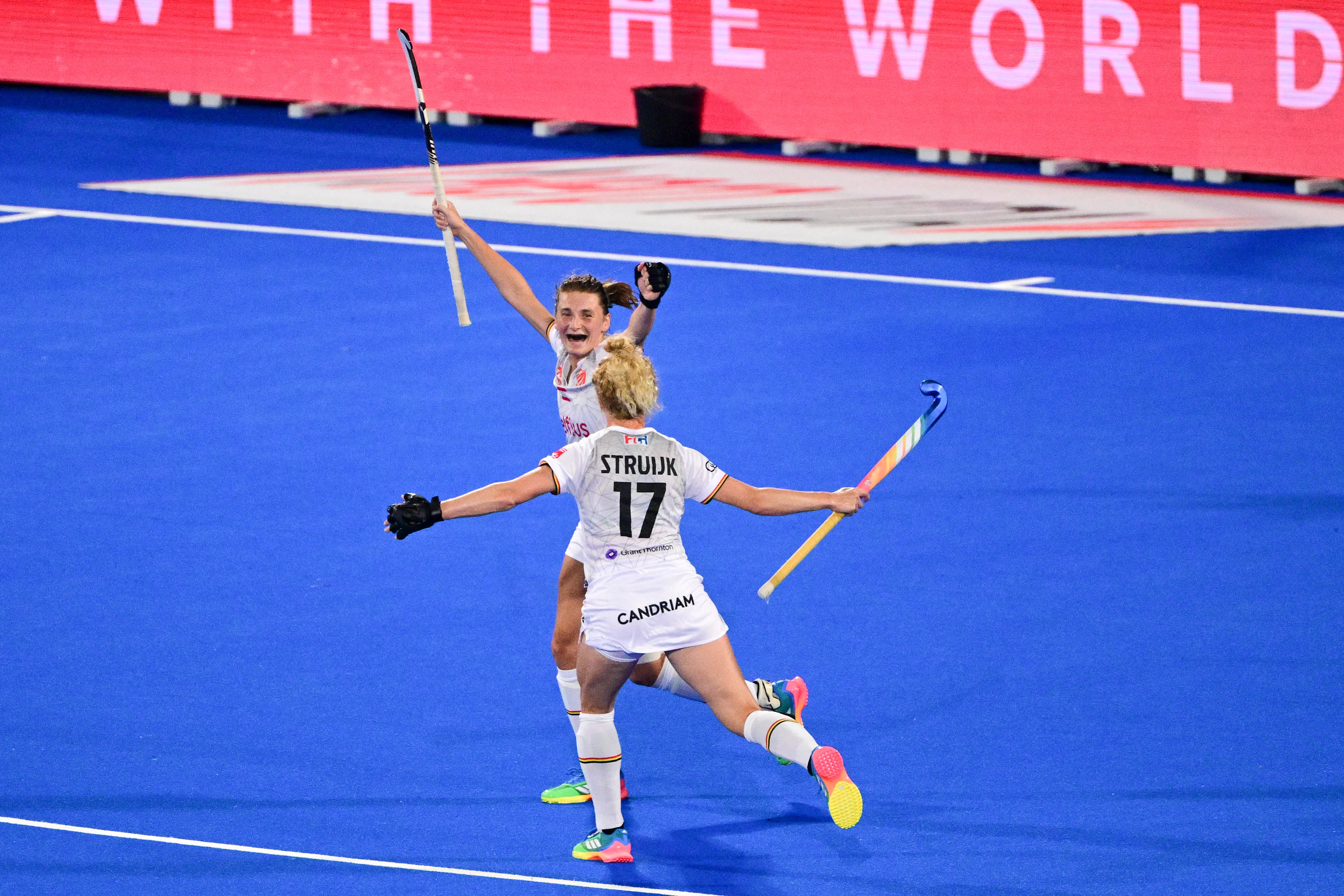 Belgium's Stephanie Vanden Borre and Belgium's Michelle Struijk celebrate after scoring during a field hockey game between Belgian national team Red Panthers and Spain during the group stage of the women's 2026 Hockey World Cup, on Tuesday 18 August 2026, in Wavre. The 2026 edition of the Hockey World Cup takes place in Belgium and The Netherlands from August 15 to August 30. BELGA PHOTO DIRK WAEM