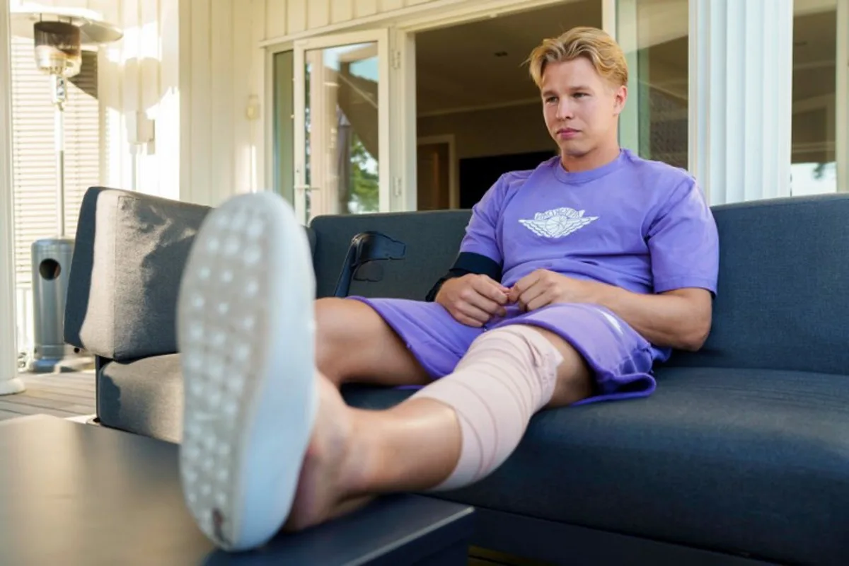 Norway's Olympic decathlon champion Markus Rooth sits with his leg up in Oslo on Augist 25, 2025 after he injured himself during pole vault training and will miss the upcoming World Athletics Championships in Tokyo. Cornelius Poppe / NTB / AFP