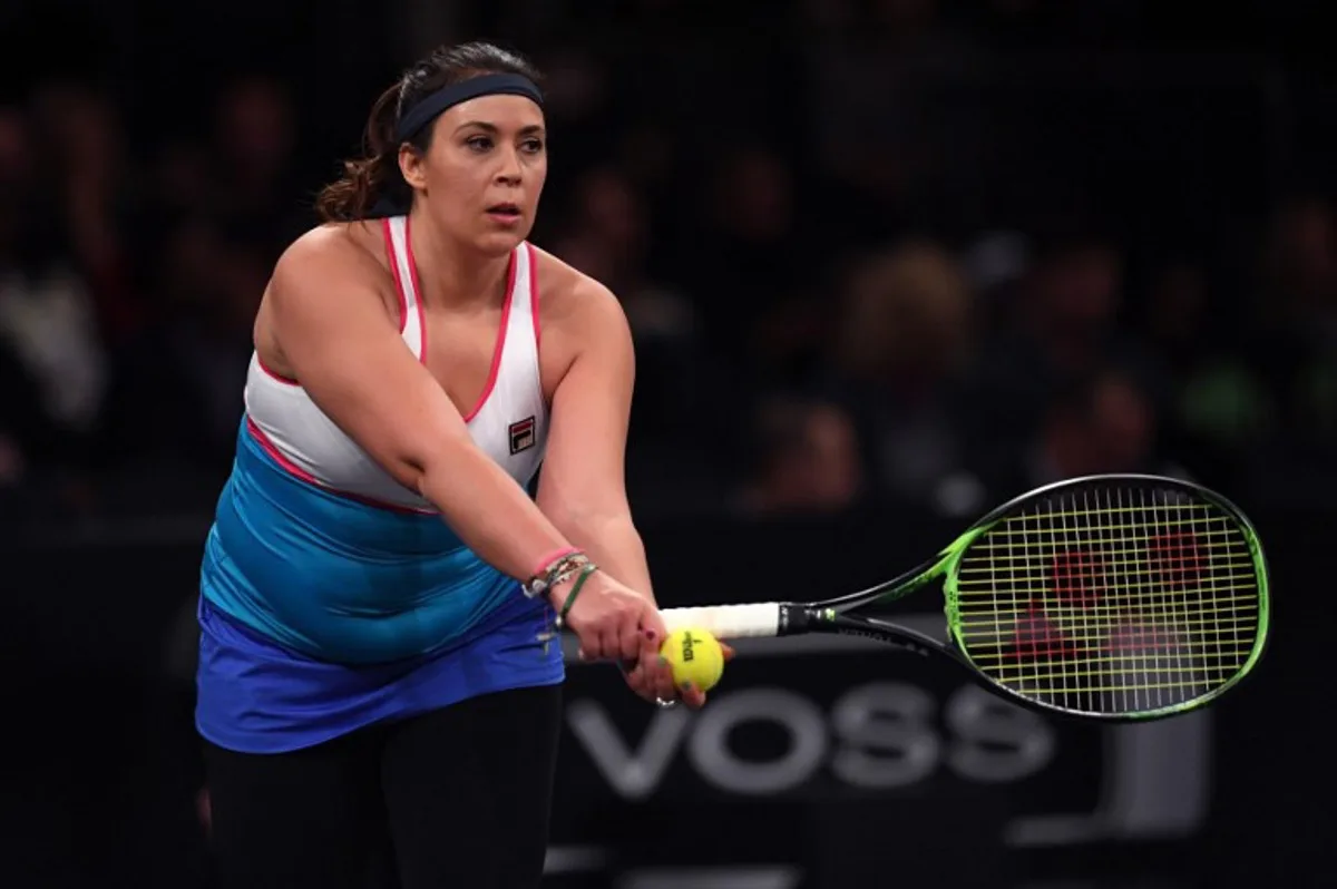Marion Bartoli of France returns against Serena Williams of the US during the Tie Break Tens New York tournament at Madison Square Garden March 5, 2018 featuring eight of the tour's top female players competing for the $250,000 winner's prize. TIMOTHY A. CLARY / AFP