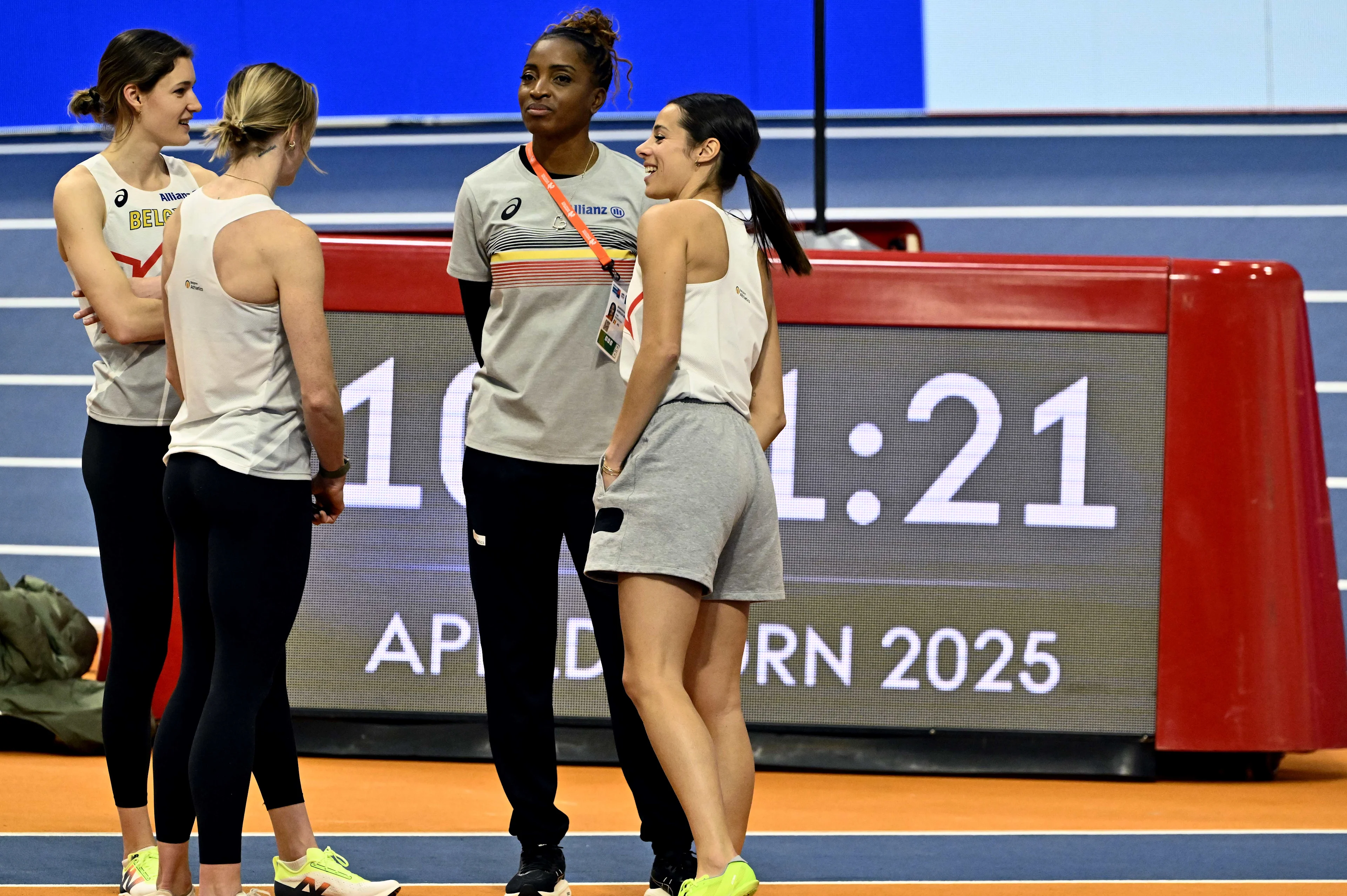 Belgian Imke Vervaet, Belgian Helena Ponette, Belgian Camille Laus and coach Carole Kaboud Me Bam pictured at a training session ahead of the European Athletics Indoor Championships, in Apeldoorn, The Netherlands, Wednesday 05 March 2025. The championships take place from 6 to 9 March. BELGA PHOTO ERIC LALMAND