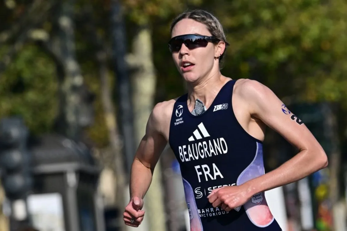 France's Cassandre Beaugrand runs during a Test Event for the women's triathlon for the upcoming 2024 Olympic Games in Paris, on August 17, 2023. From August 17 to 20, 2023, Paris 2024 is organising four triathlon events to test several arrangements, such as the sports operations, one year before the Paris 2024 Olympic and Paralympic Games. Miguel MEDINA / AFP