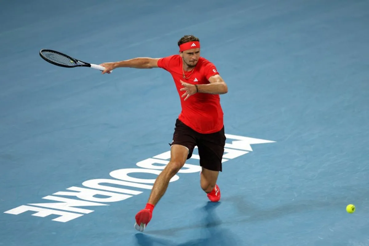 Germany's Alexander Zverev hits a shot against France's Lucas Pouille during their men's singles match on day one of the Australian Open tennis tournament in Melbourne on January 12, 2025.  Adrian Dennis / AFP