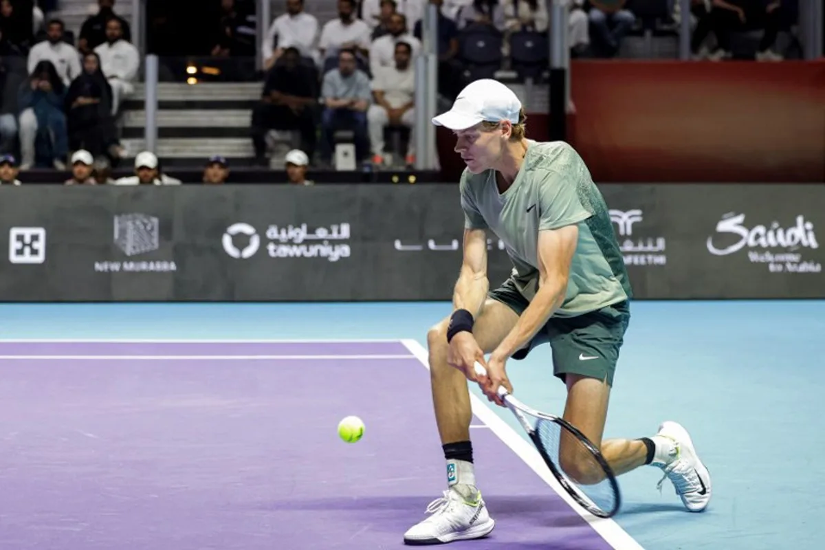 Italy's Jannik Sinner hits a return to Spain's Carlos Alcaraz during their final tennis match in the "6 Kings Slam" exhibition tournament in Riyadh on October 19, 2024.  Fayez NURELDINE / AFP