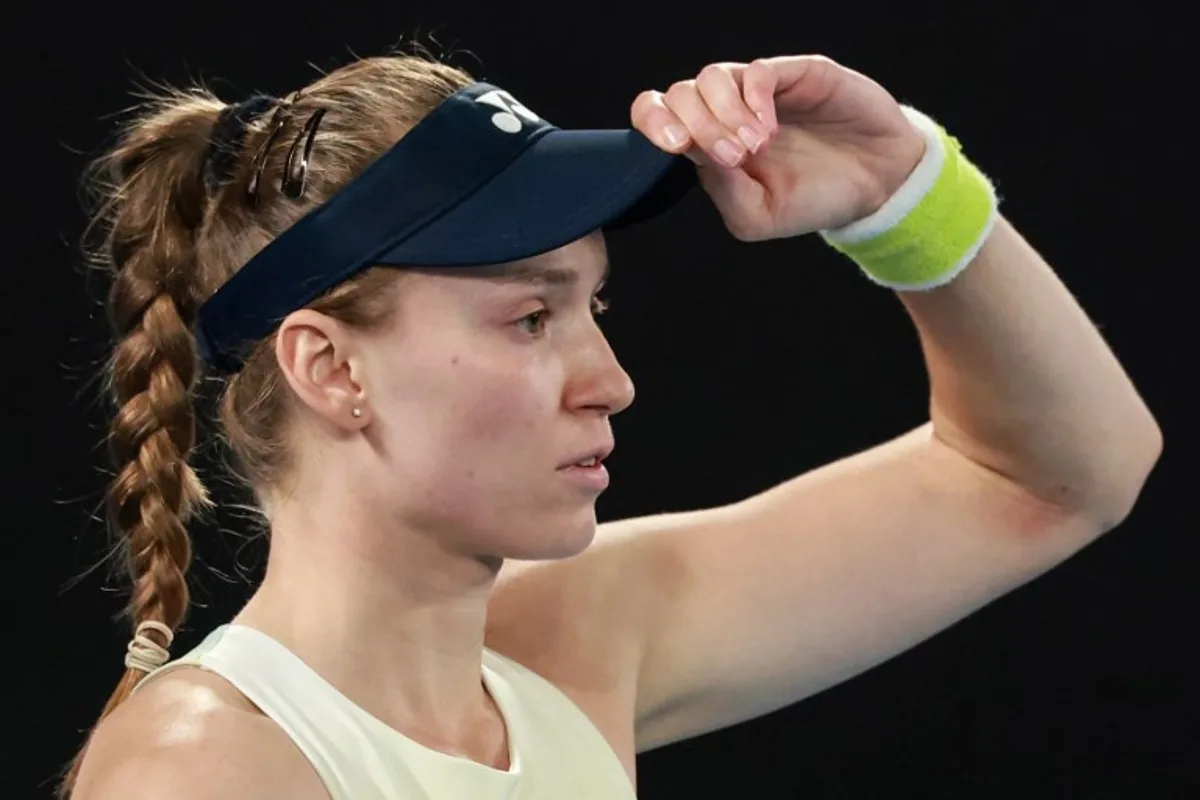 Kazakhstan's Elena Rybakina prepares to play a point against Belarus' Aryna Sabalenka during their women's singles final match on day fourteen of the Australian Open tennis tournament in Melbourne on January 31, 2026. DAVID GRAY / AFP