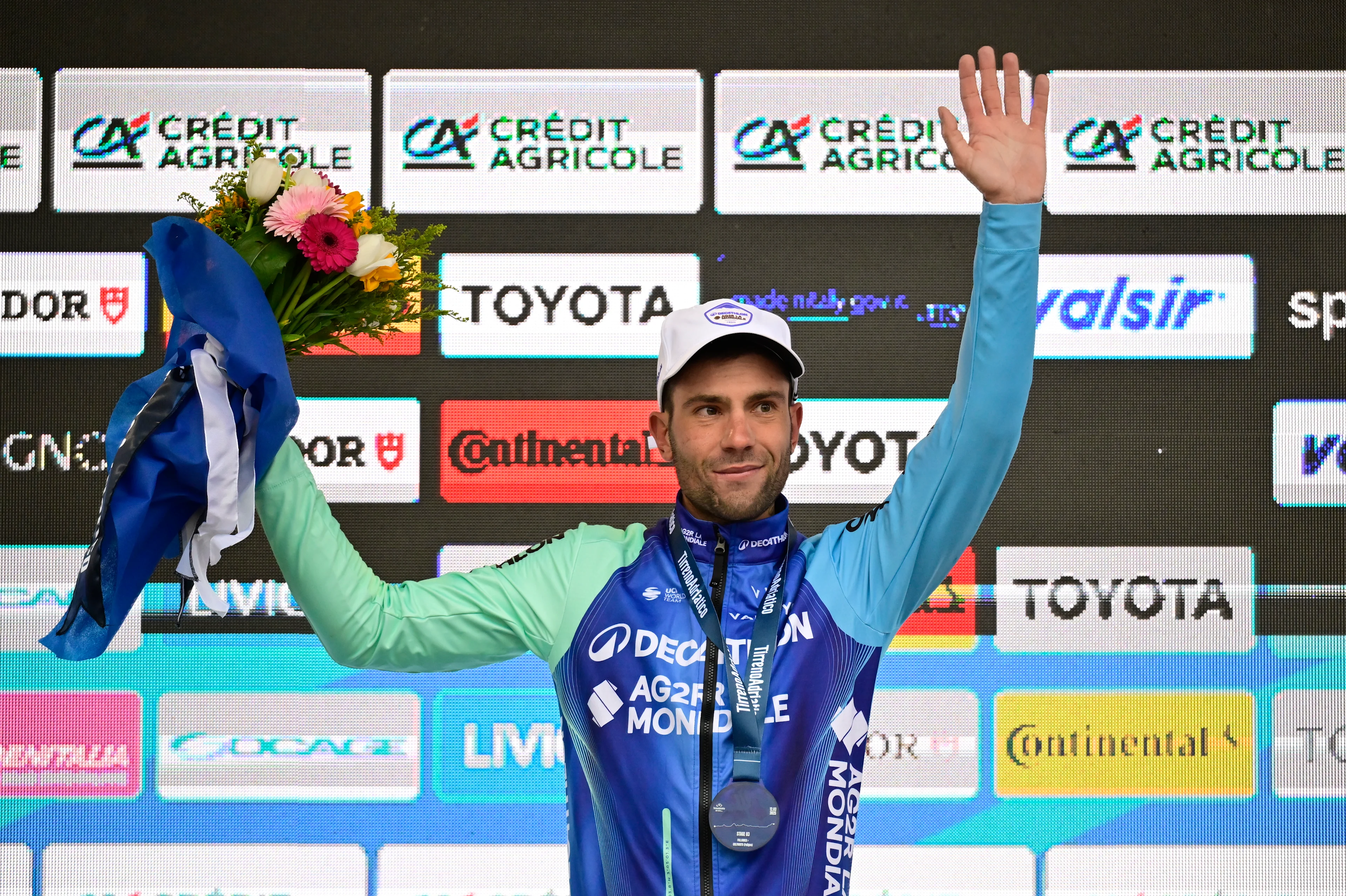 Italian Andrea Vendrame of Decathlon AG2R La Mondiale Team celebrates on the podium after winning the third stage of the Tirreno-Adriatico cycling race, a 239km race from Follonica to Colfiorito (Foligno), Italy, Wednesday 12 March 2025. BELGA PHOTO DIRK WAEM