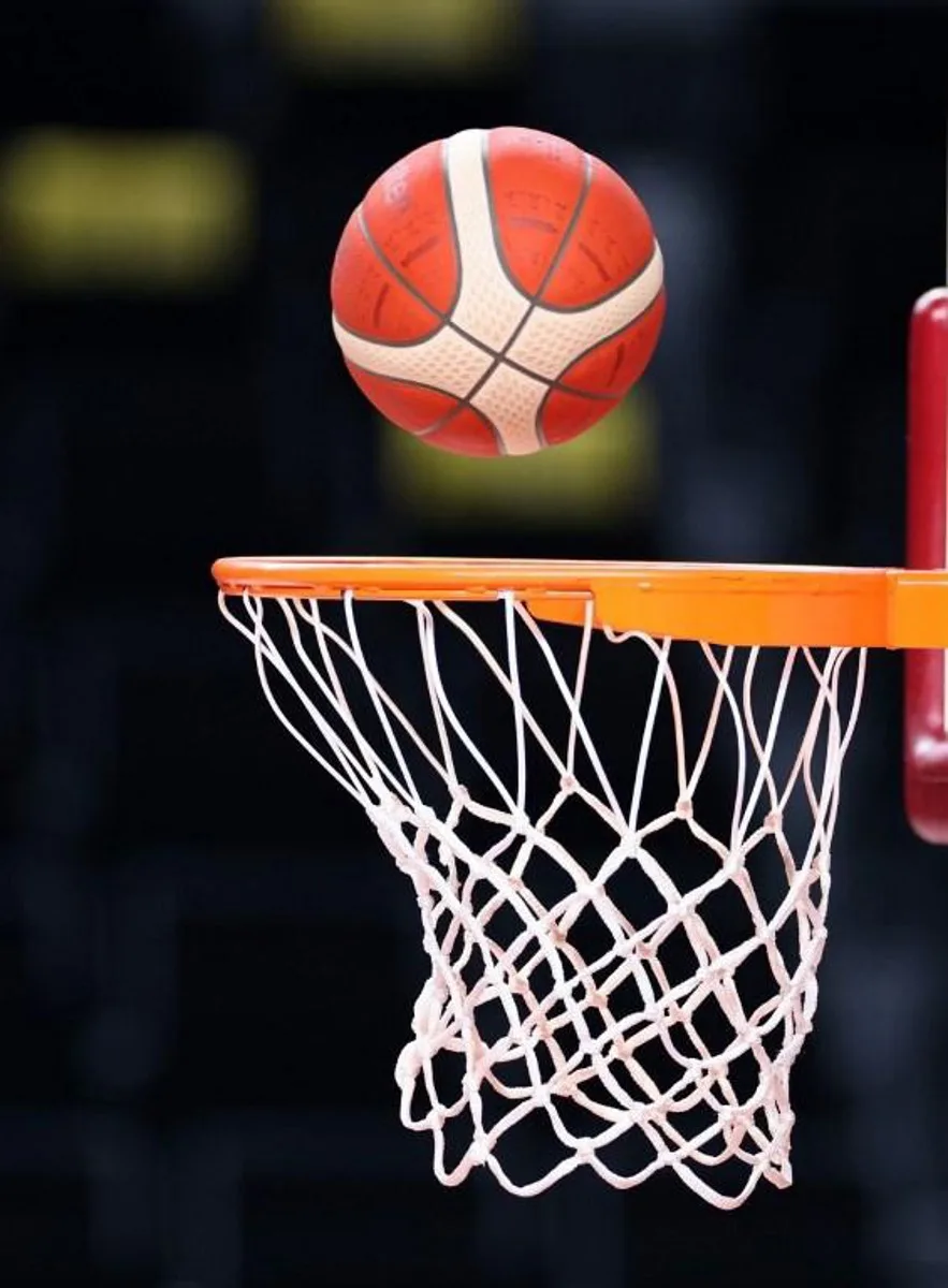 An Olympic basketball drops through a net during Spain's basketball team training session at the Saitama Super Arena in Saitama on July 23, 2021, ahead of the Tokyo 2020 Olympic Games.   Thomas COEX / AFP