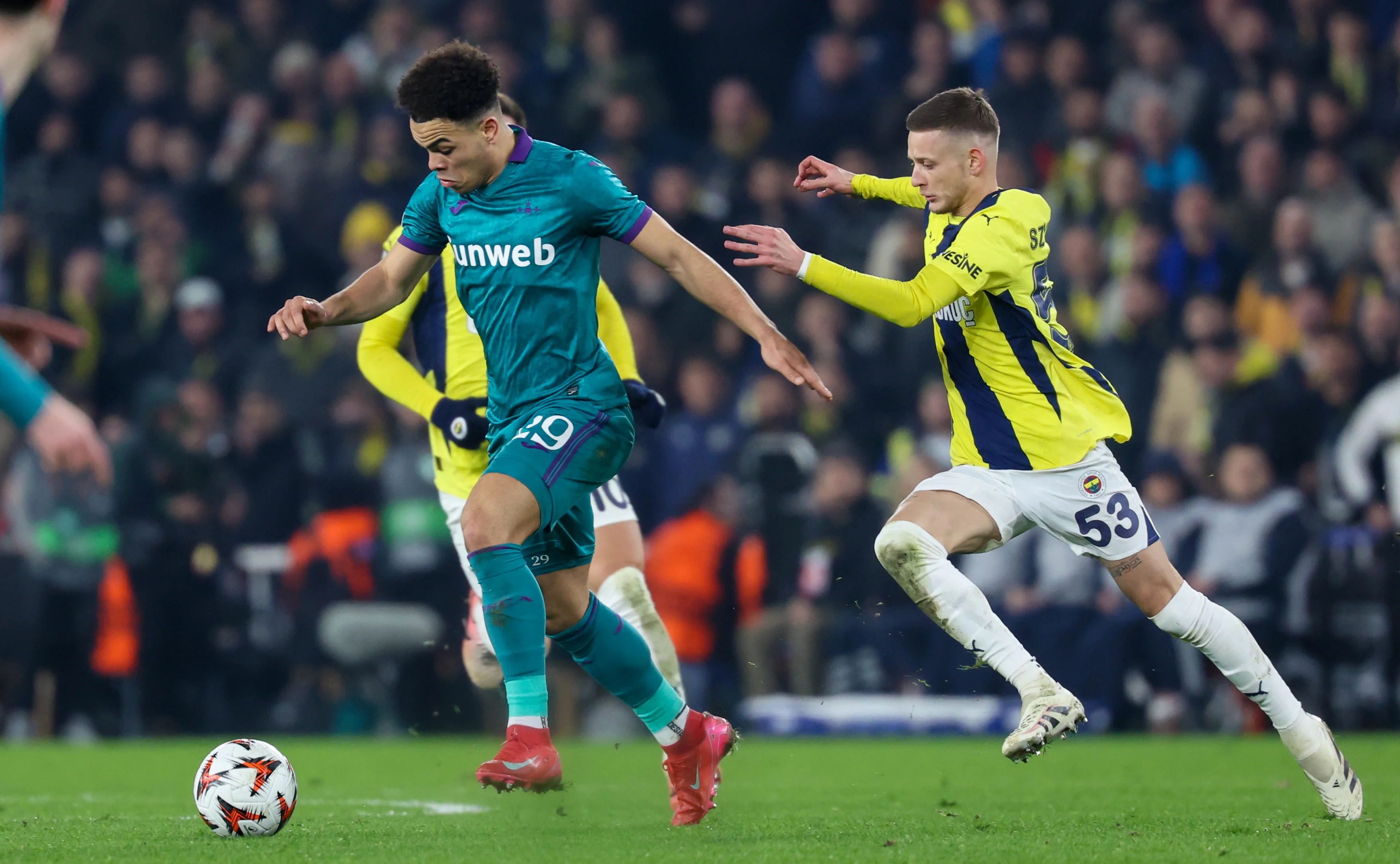 Anderlecht's Mario Stroeykens and Fenerbahce's Sebastian Szymanski fight for the ball during a soccer game between Turkish Fenerbahce SK and Belgian RSC Anderlecht, on Thursday 13 February 2025 in Istanbul, Turkey, the first leg of the Knockout phase play-offs of the UEFA Europa League competition. BELGA PHOTO VIRGINIE LEFOUR