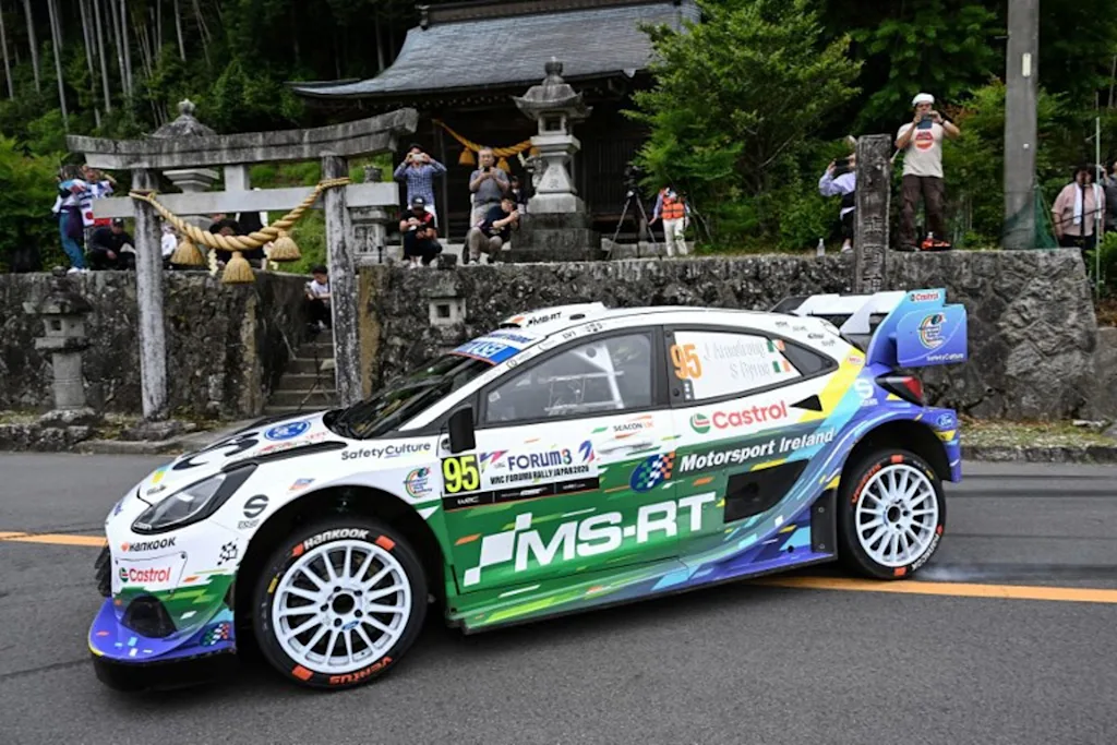 Jon Armstrong of Ireland and his co-driver Shane Byrne of Ireland drive their Ford Puma Rally1 during the SS16 Lake Mikawako section of the Rally Japan, the 7th round of FIA World Rally Championships, in Toyota city, Aichi prefecture on May 31, 2026.  Toshifumi KITAMURA / AFP