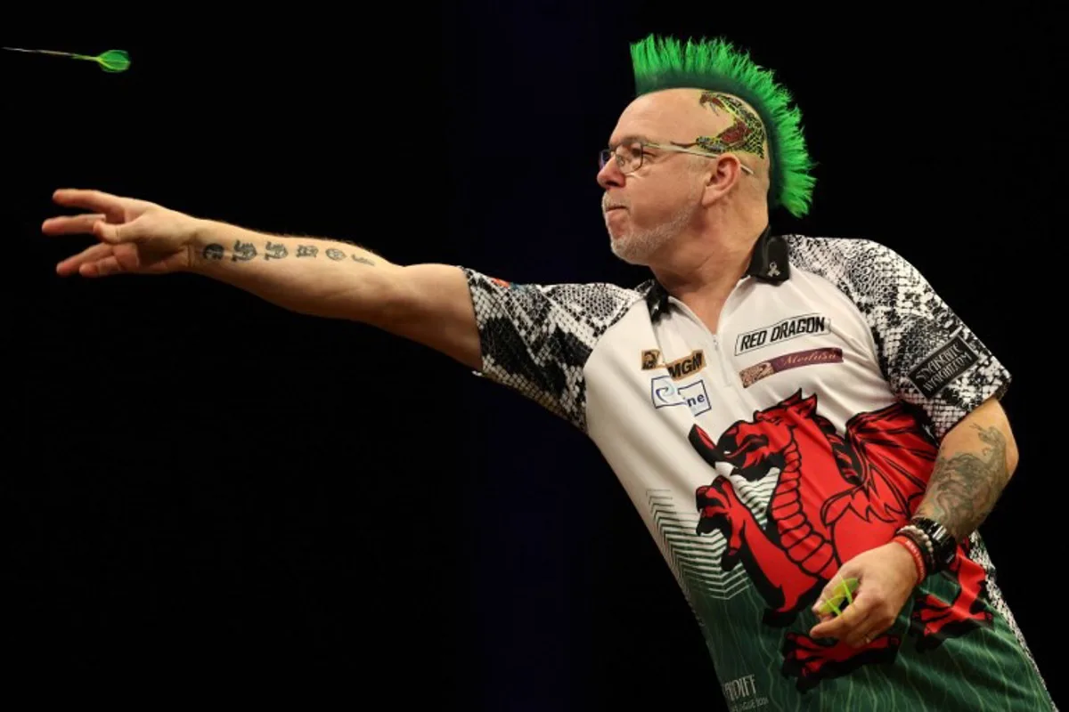 Scotland's Peter Wright competes during his quarter-final darts match against England's Rob Cross on Night 1 of the PDC Premier League, at the Utilita Arena in Cardiff, south Wales on February 1, 2024.  Adrian DENNIS / AFP