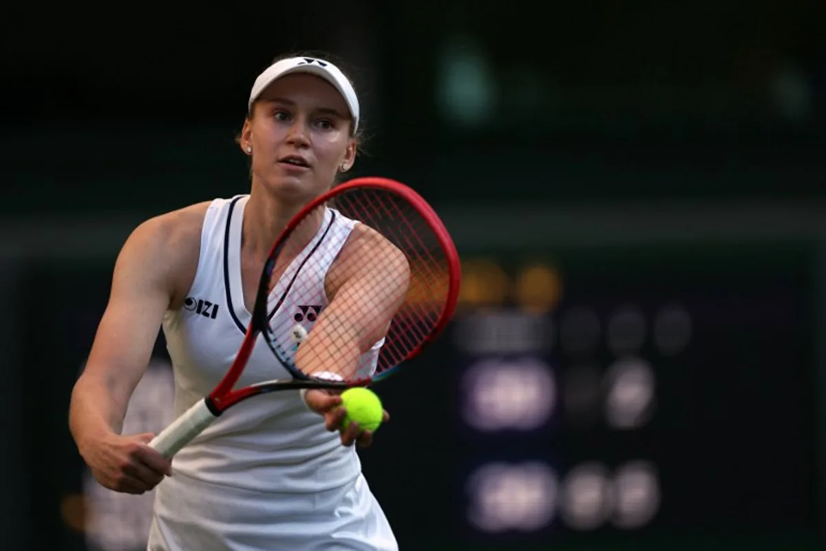 Kazakhstan's Elena Rybakina serves to US player Caty McNally during their women's singles second round tennis match on the fourth day of the 2026 Wimbledon Championships at The All England Lawn Tennis and Croquet Club in Wimbledon, southwest London, on July 2, 2026.  Adrian Dennis / AFP