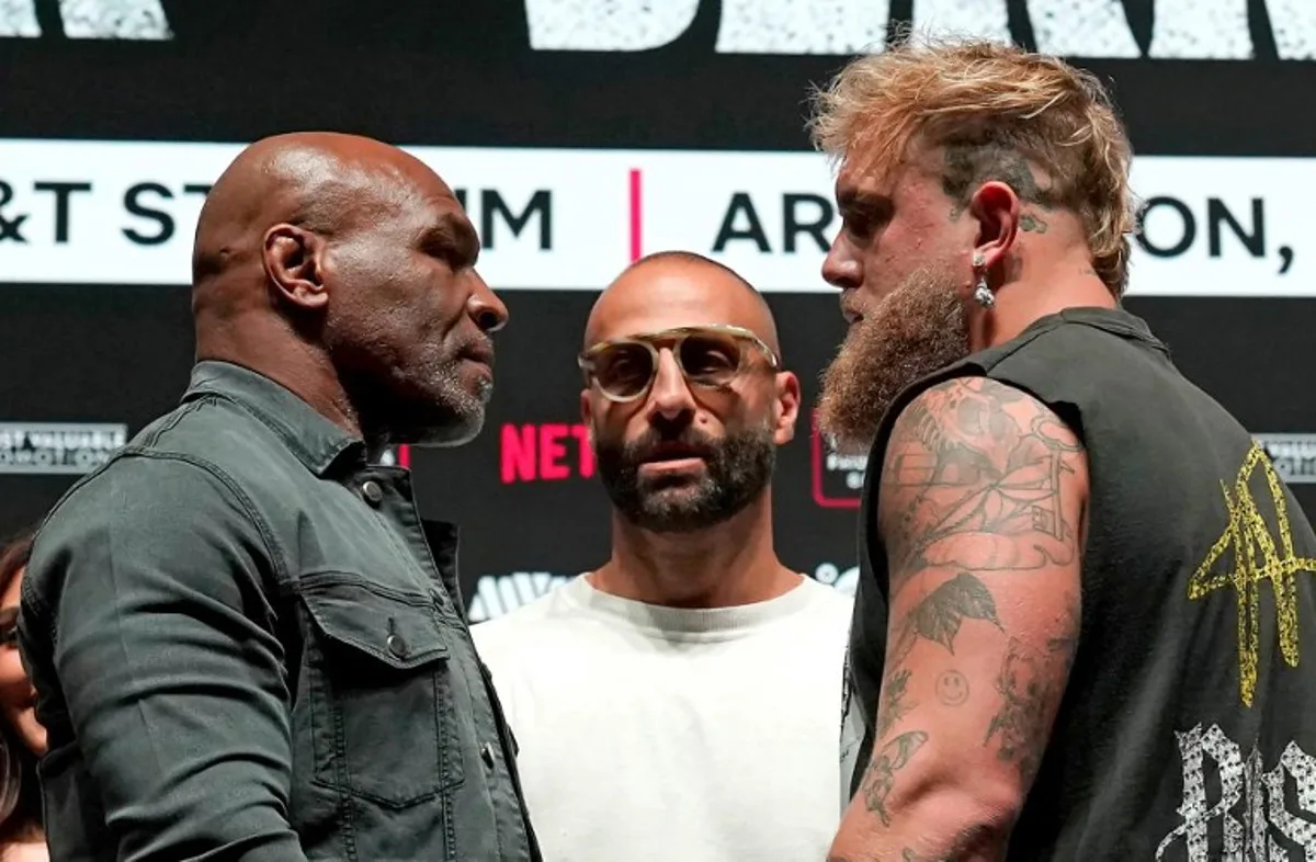 US boxer Mike Tyson (L) and US boxer-actor Jake Paul (R) face each other during a press conference ahead of their heavyweight bout at The Pavilion at Toyota Music Factory in Irving, Texas on November 13, 2024.    TIMOTHY A. CLARY / AFP