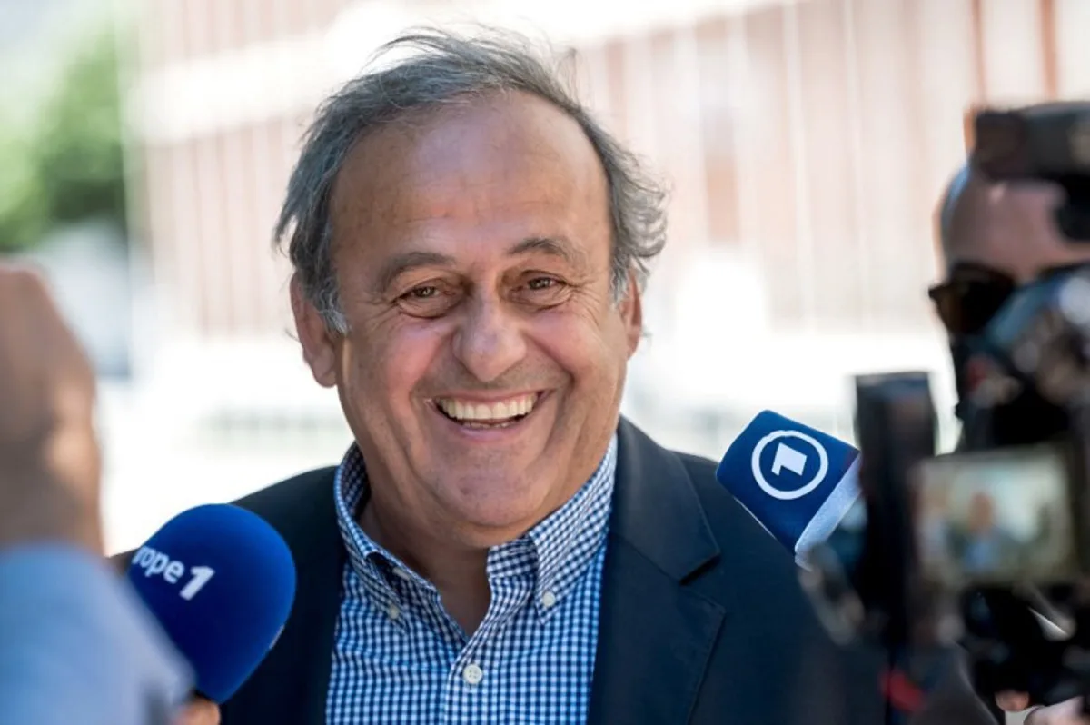 Former UEFA president Michel Platini reacts as he talks to journalists after the verdict of his trial over a suspected fraudulent payment, at Switzerland's Federal Criminal Court, in the southern Switzerland city of Bellinzona, on July 8, 2022. Sepp Blatter and Michel Platini, once the chiefs of world and European football, were acquitted over a suspected fraudulent payment that shook the sport and torpedoed their time at the top. Fabrice COFFRINI / AFP