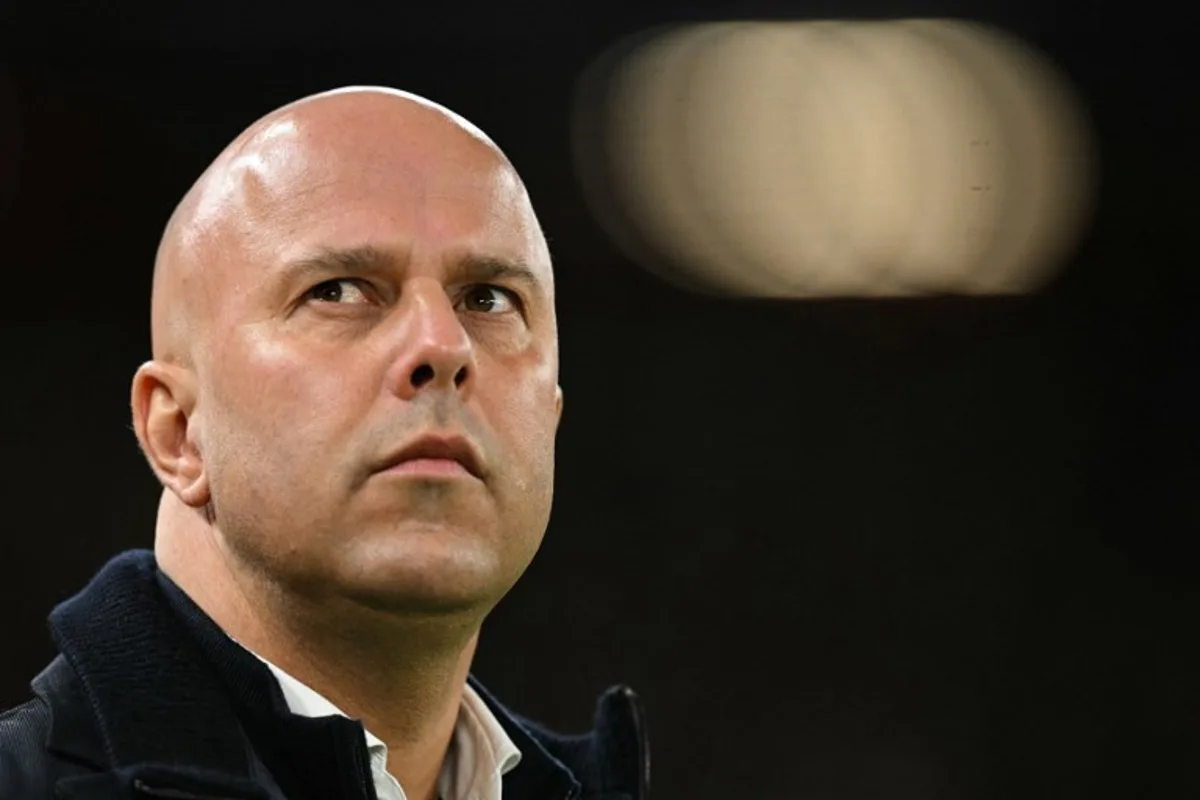 Liverpool's Dutch manager Arne Slot reacts during the last 16 second leg UEFA Champions League football match between Liverpool and Paris Saint-Germain (PSG) at Anfield in Liverpool, north west England on March 11, 2025.  Oli SCARFF / AFP