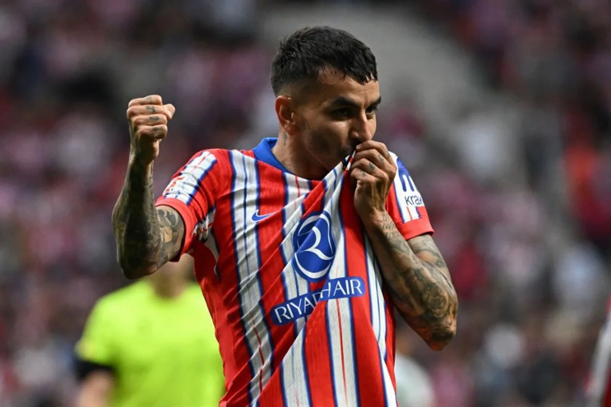 Atletico Madrid's Argentine forward #10 Angel Correa celebrates scoring his team's fourth goal during the Spanish league football match between Club Atletico de Madrid and Real Betis at Metropolitano Stadium in Madrid on May 18, 2025. JAVIER SORIANO / AFP