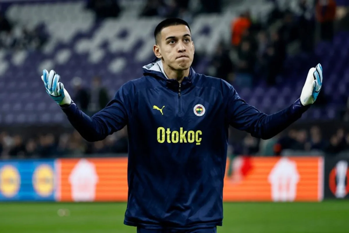 Fenerbahce's Turkish goalkeeper #01 Irfan Can Egribayat reacts during warm up ahead of the UEFA Europa League knockout phase play-off 2nd leg football match between Fenerbahce SK (TUR) and RSC Anderlecht (BEL) at the Lotto Park Stadium in Brussels, on February 20, 2025.  Simon Wohlfahrt / AFP