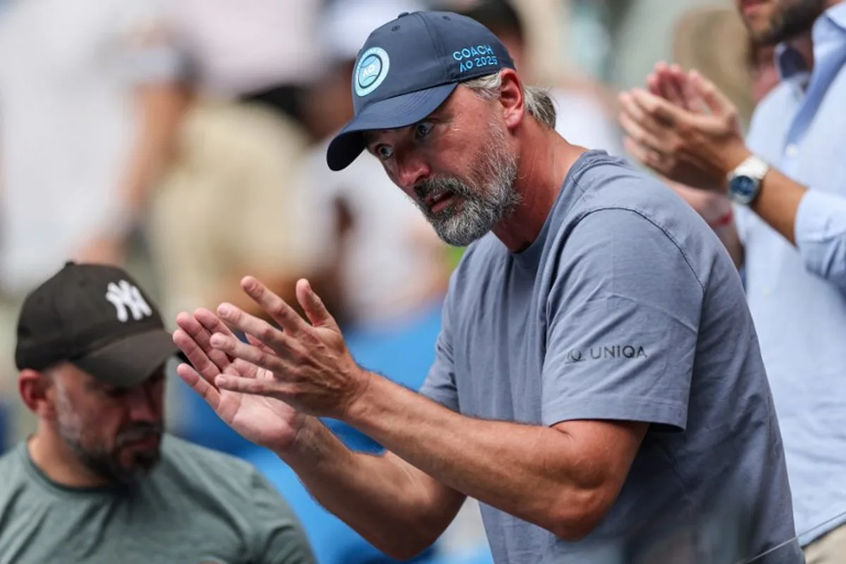 Croatian former professional tennis player Goran Ivanisevic and coach of Kazakhstan's Elena Rybakina gestures as he watches her play against USA's Madison Keys during their women's singles match on day nine of the Australian Open tennis tournament in Melbourne on January 20, 2025.  Adrian DENNIS / AFP